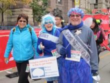 Linda, Carol, and Andrew in costumes on the marathon route