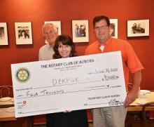 Rotary Club of Aurora presents Carol with $4000 donation!