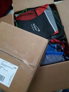 2 boxes filled with brand new reusable drawstring bags